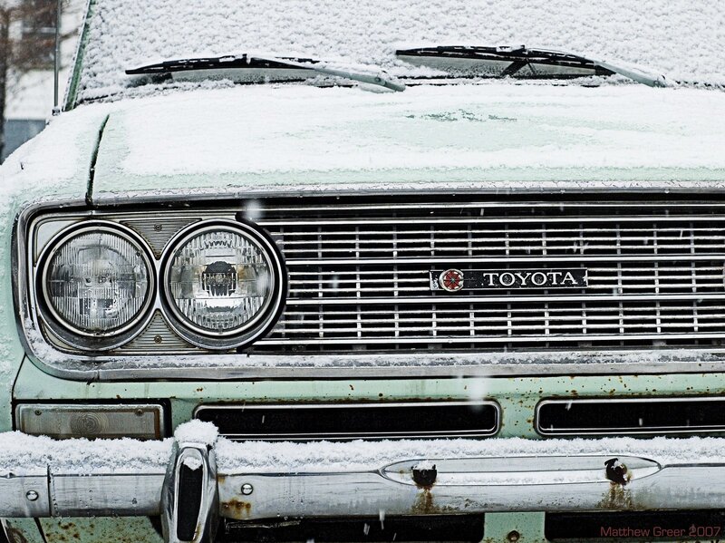 Snow-covered vintage Toyota