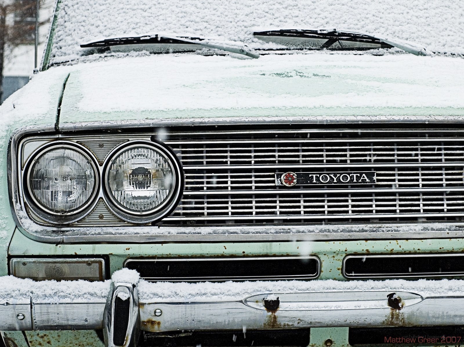 Snow-covered vintage Toyota