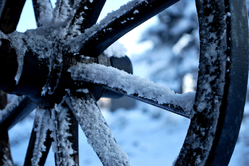 snow-covered wagon wheel