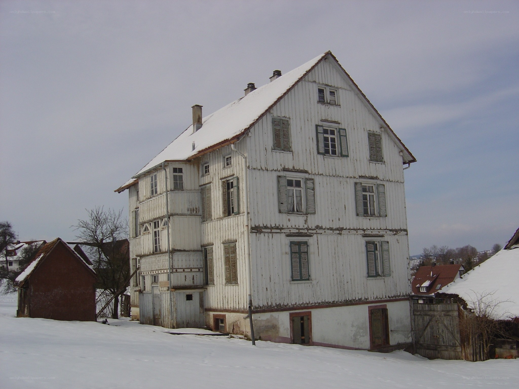 snow-covered white house in winter