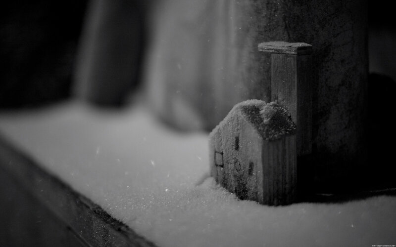 Snow-covered wooden house