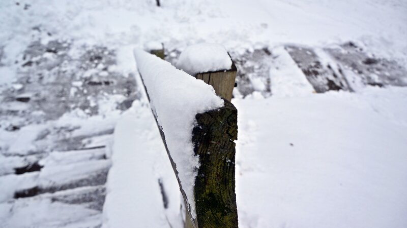 Snow-covered Wooden Railing