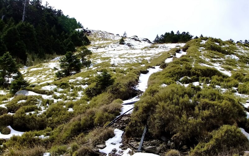 Snow-dusted mountain trail