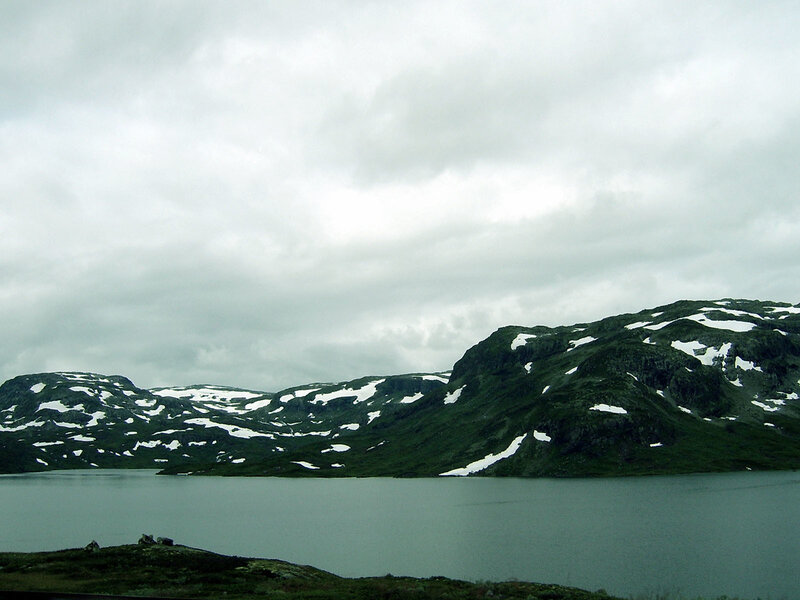 snow-dusted mountains and lake