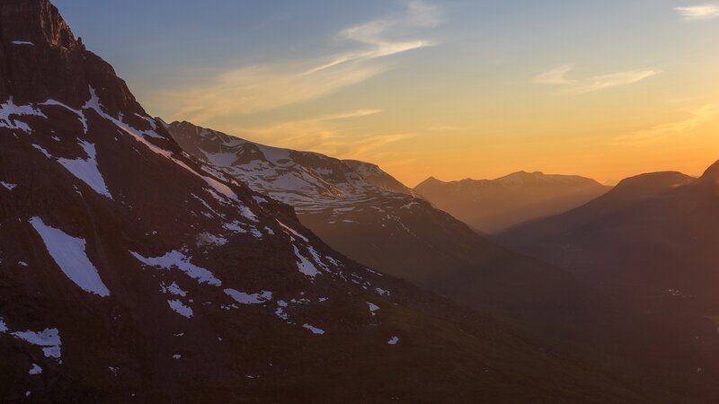 Snow-dusted Mountains at Sunset