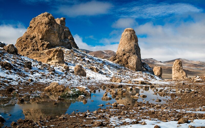Snow-dusted rock formations in desert