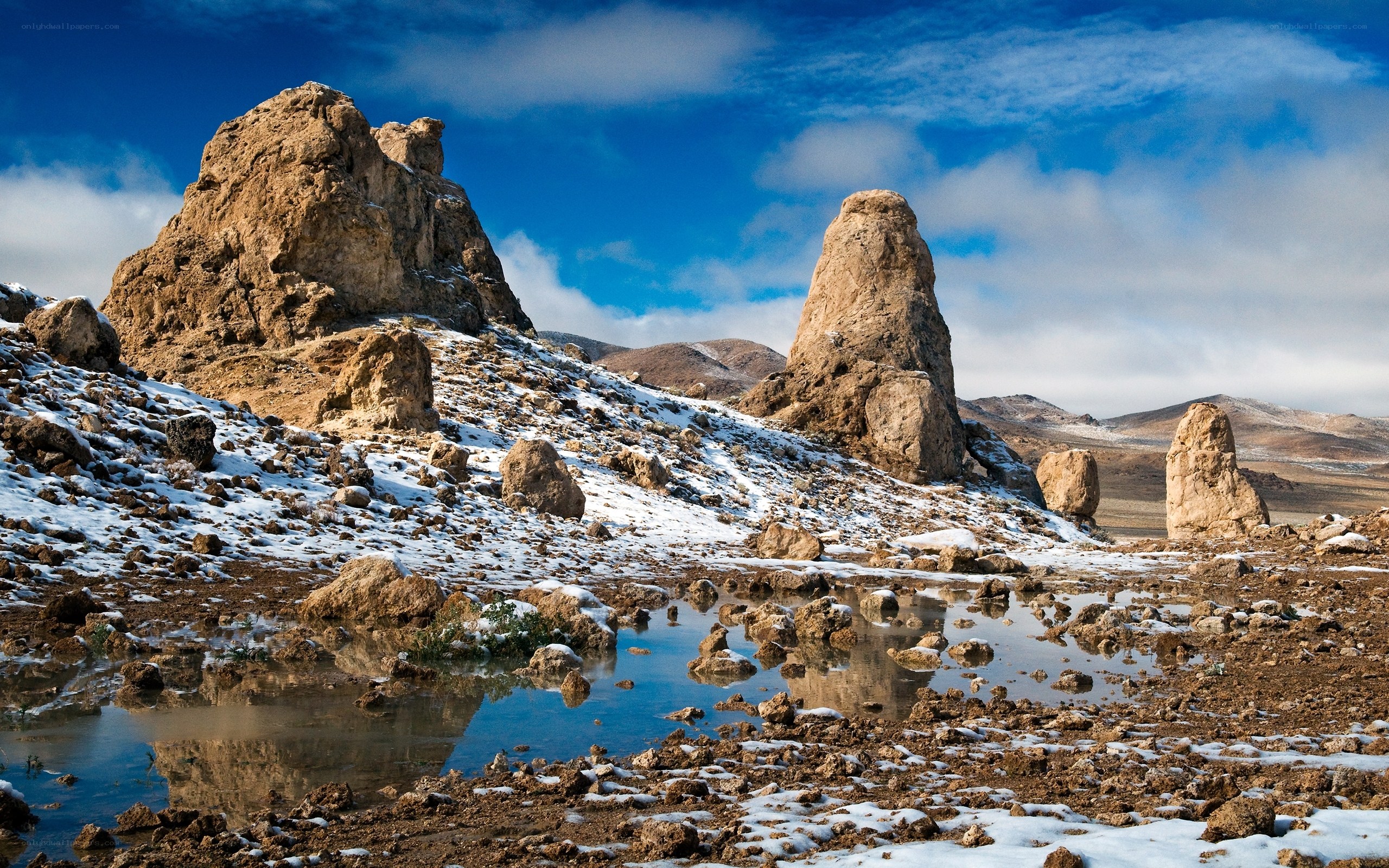Snow-dusted rock formations in desert