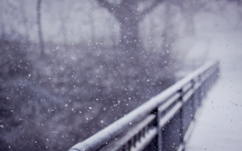 Snow Falling on Bridge