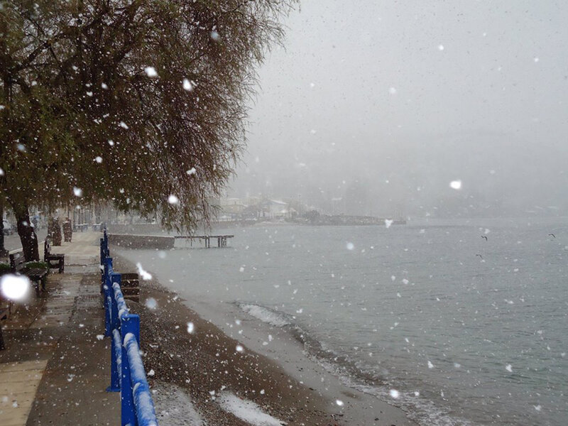 Snow Falling on Waterfront