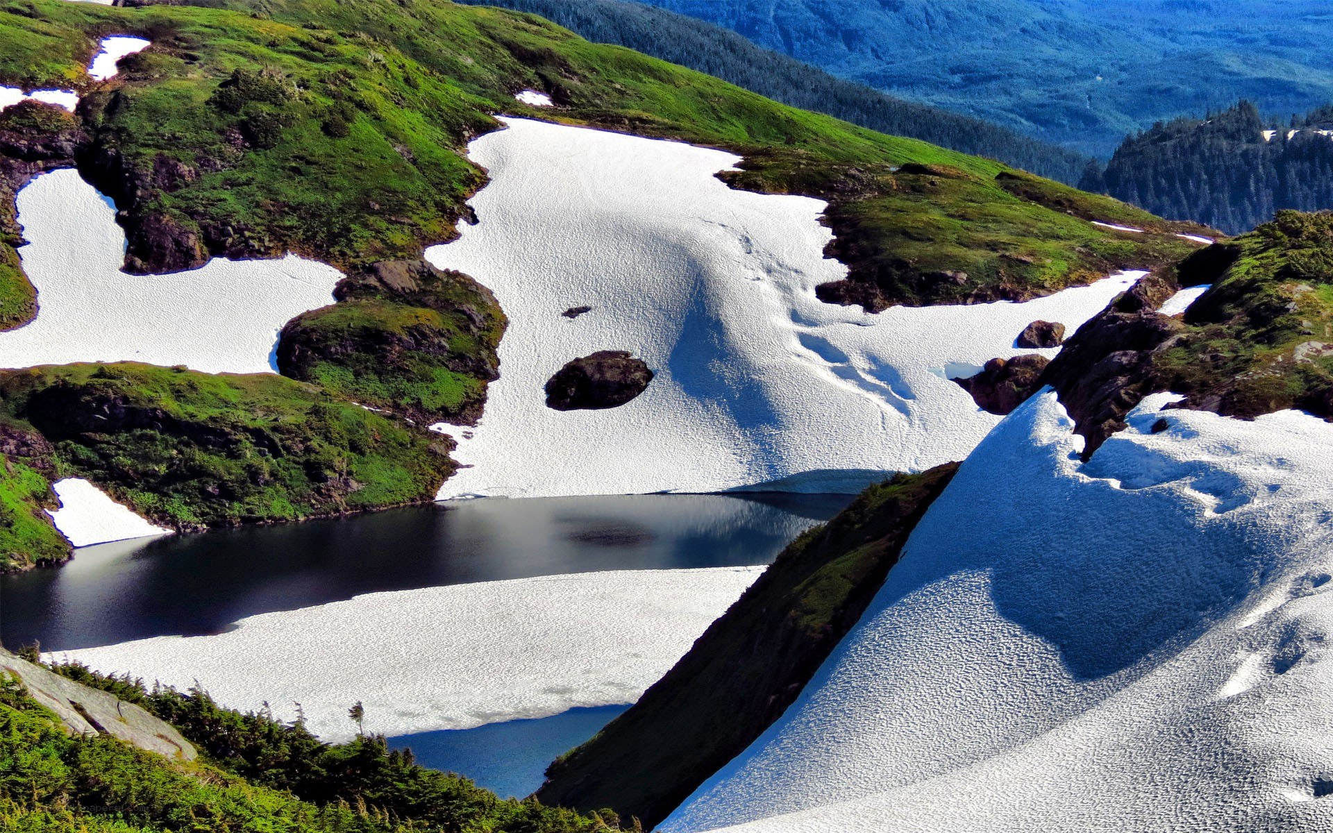 Snow patches on mountain slopes
