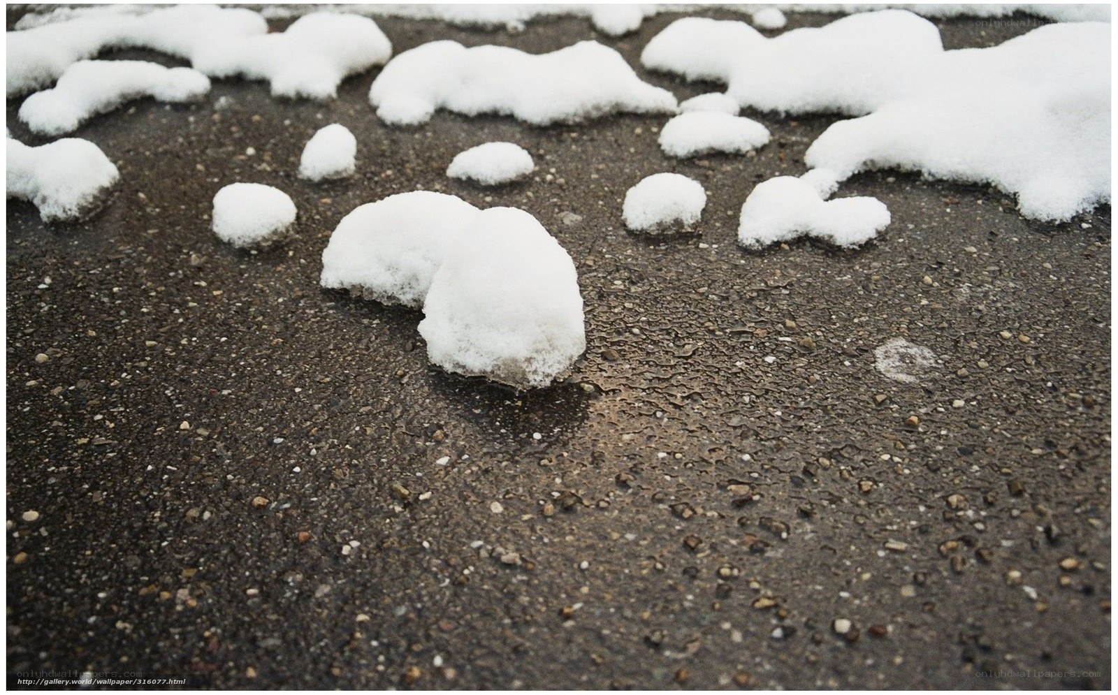 Snow patches on pavement