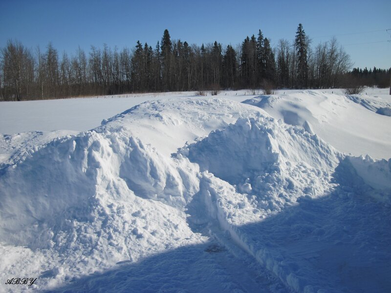 Snow Piles in Field