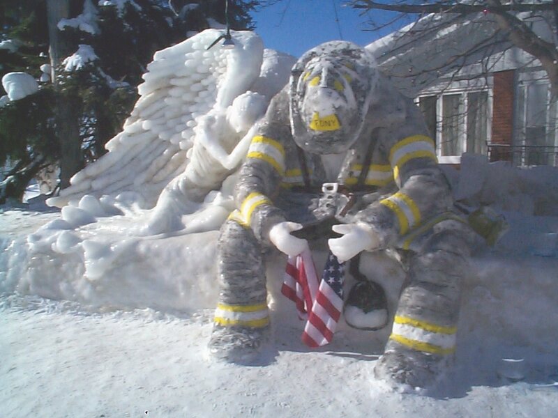 Snow sculpture of firefighter angel