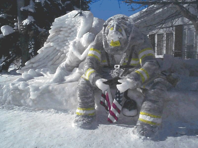 snow sculpture of firefighter angel