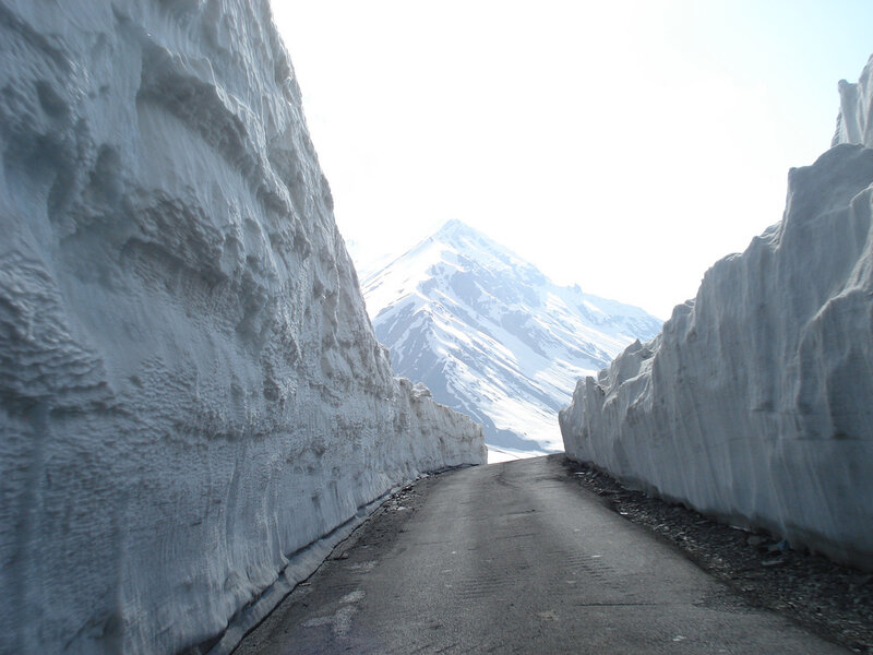 Snow tunnel on mountain road