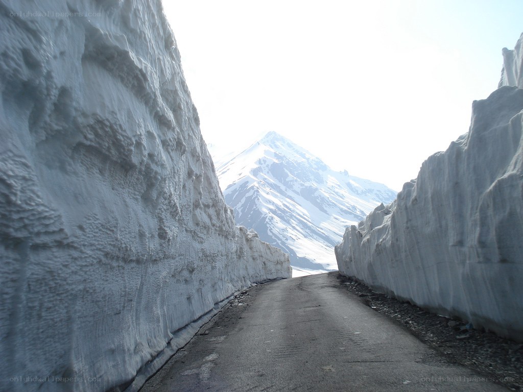 Snow tunnel on mountain road