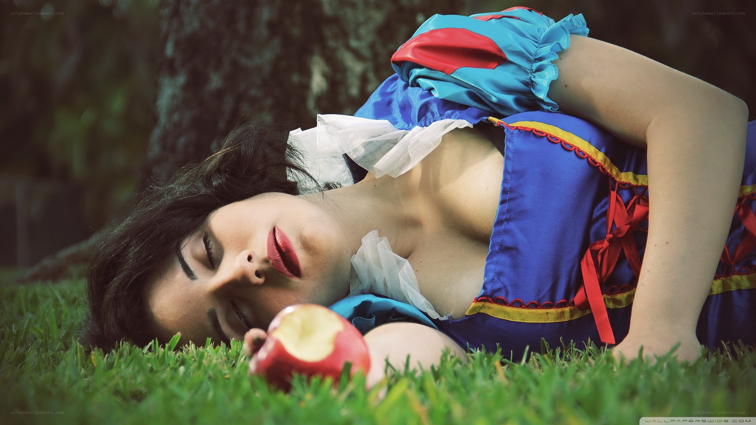 Snow White cosplayer on grass