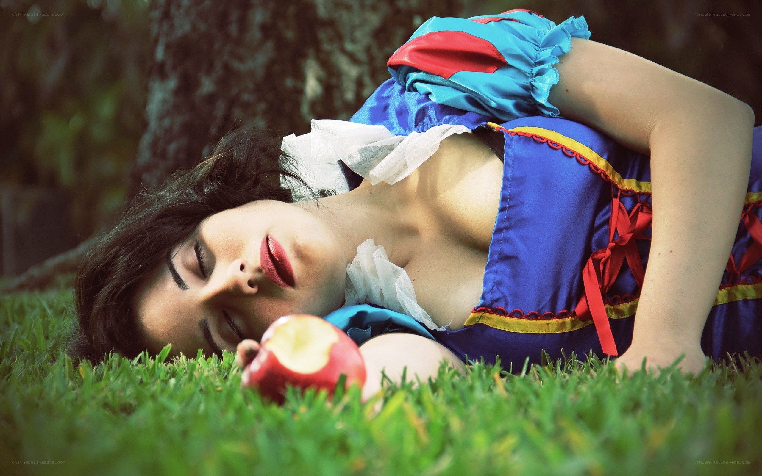Snow White cosplayer on grass