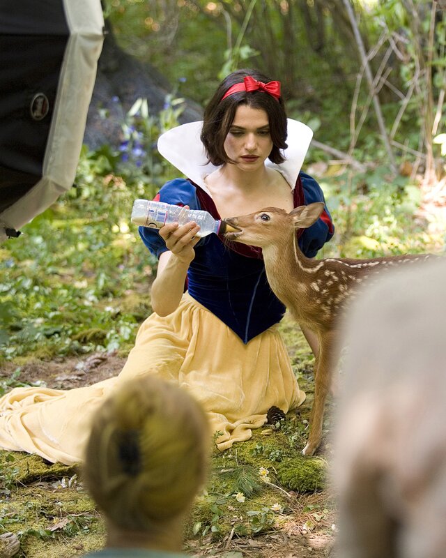 Snow White feeding a fawn