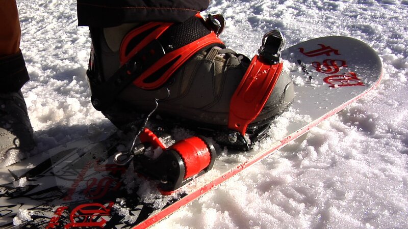 snowboard binding in snow