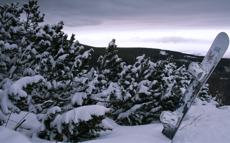 Snowboard on snowy hill
