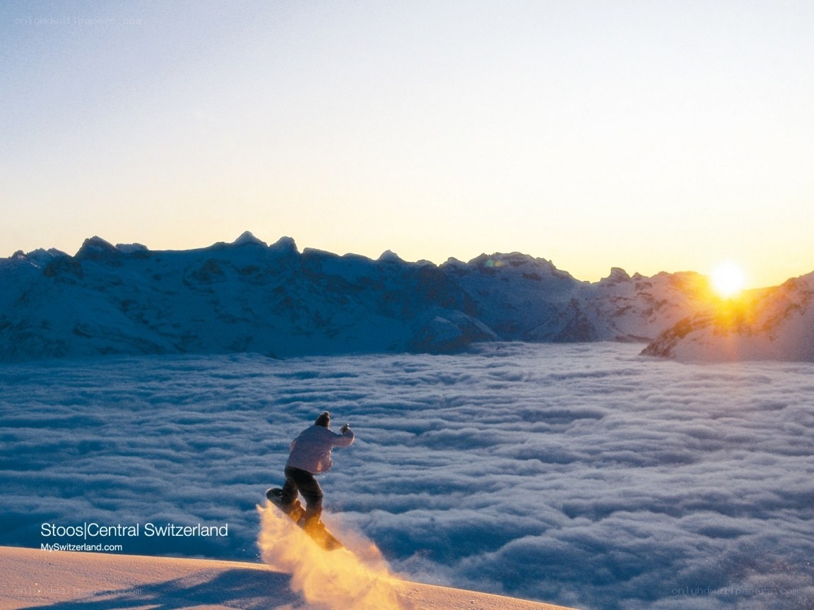 Snowboarder above the clouds