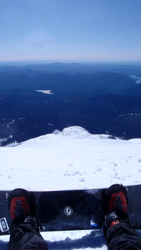 Snowboarder at mountain peak