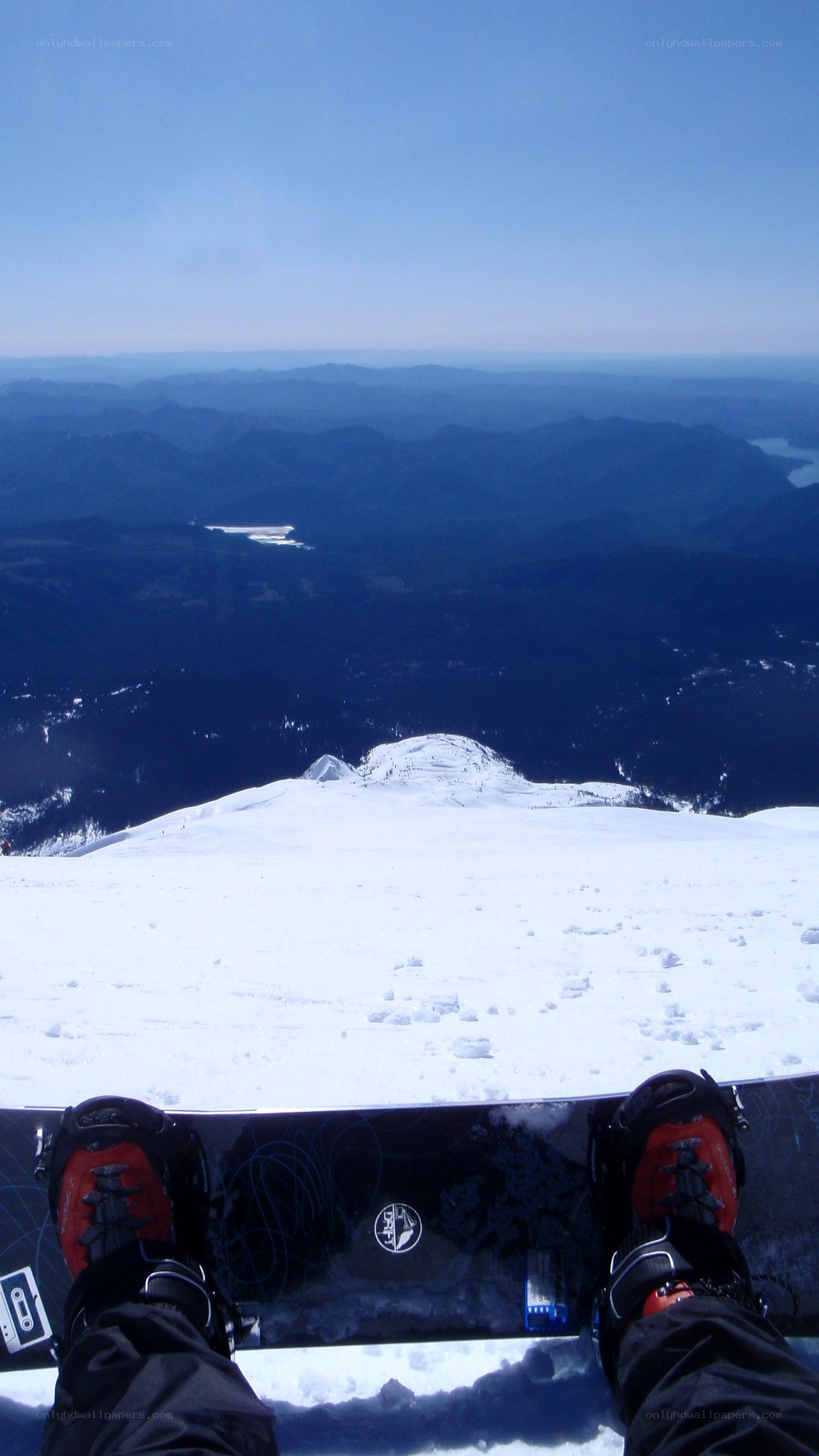 Snowboarder at mountain peak