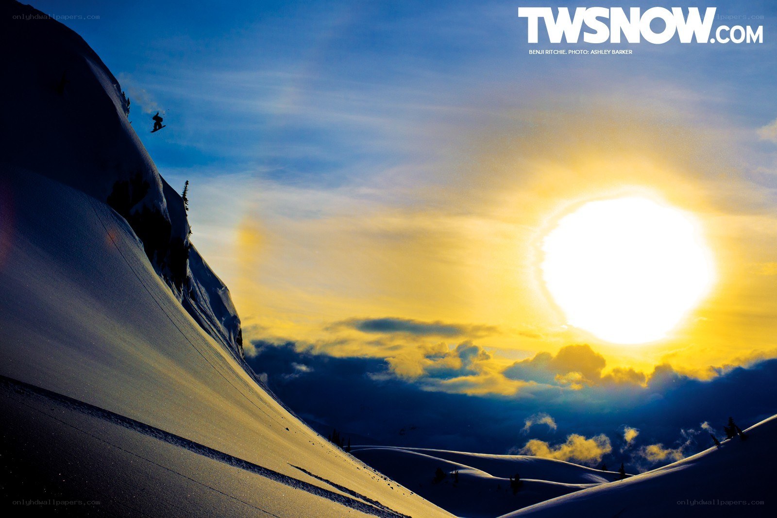 Snowboarder at sunset
