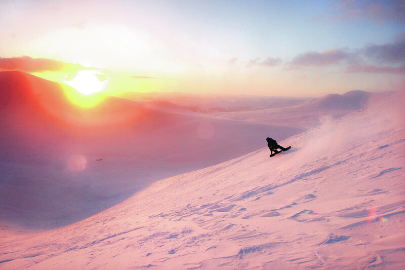 Snowboarder at sunset