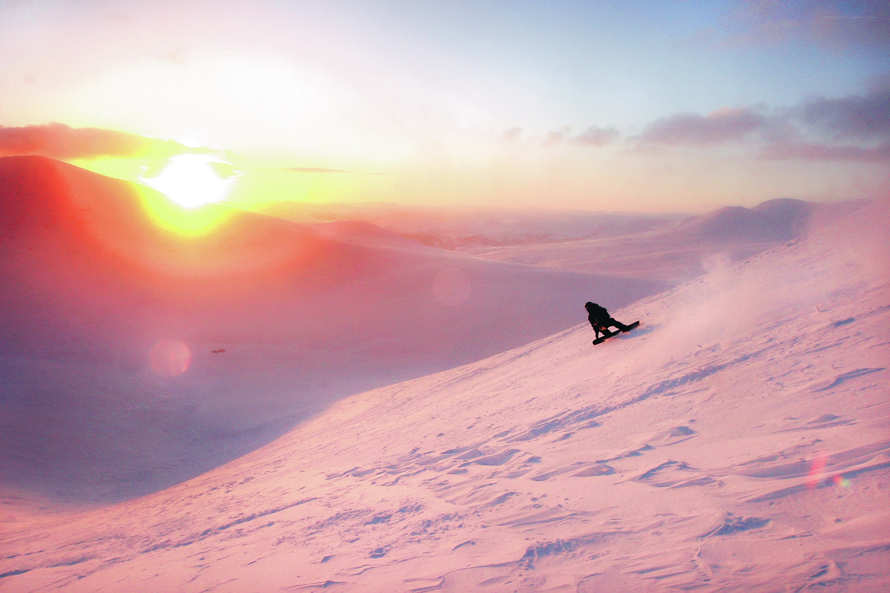Snowboarder at sunset
