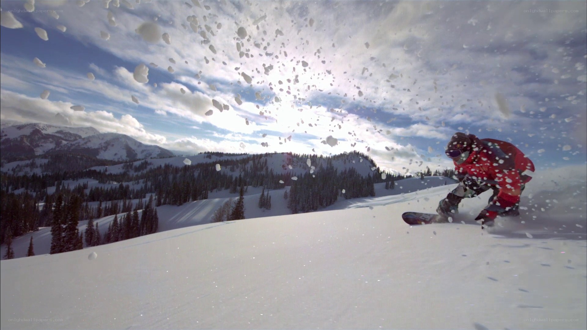 Snowboarder carving down mountain