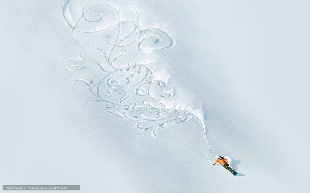 Snowboarder creating art in snow
