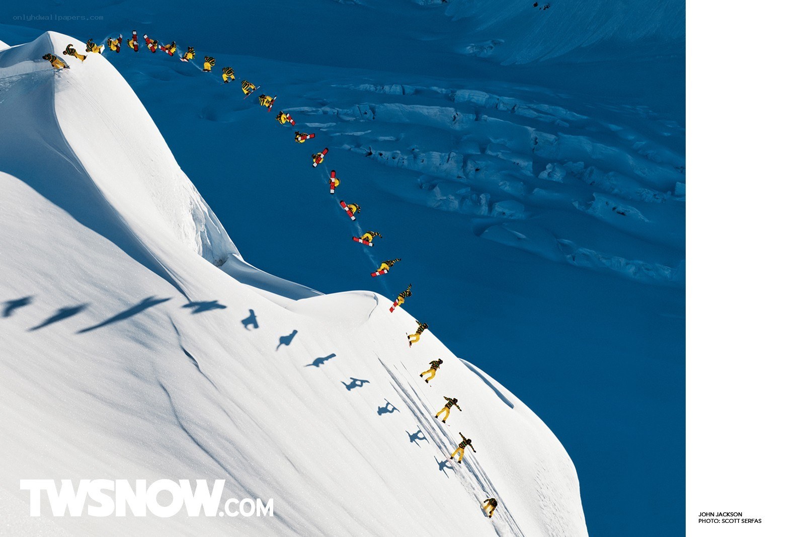 Snowboarder descending mountain