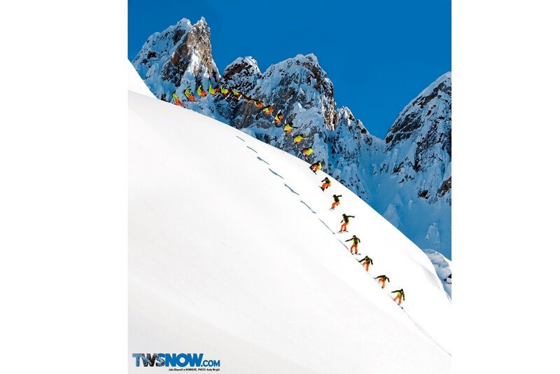 Snowboarder descending mountain