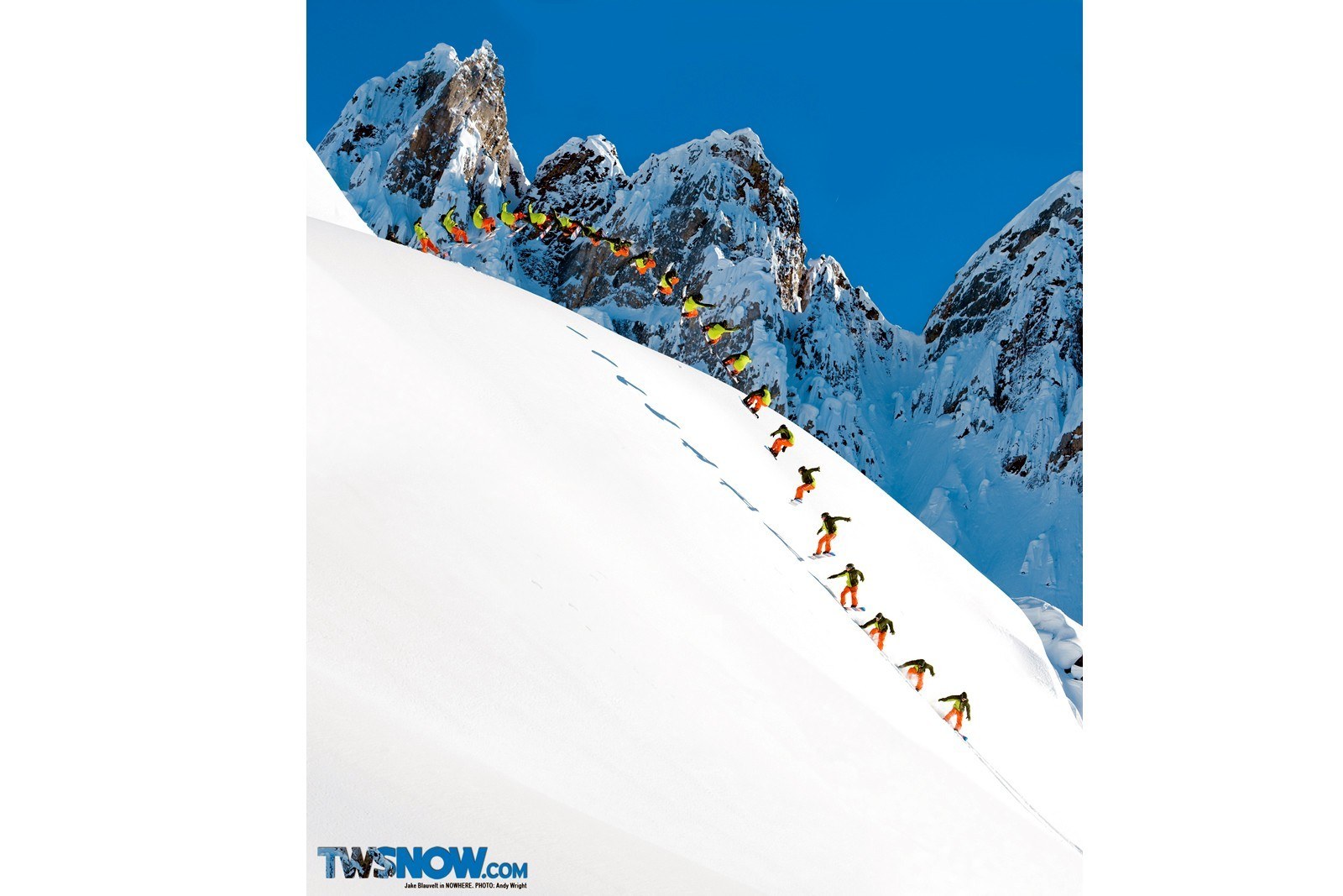 Snowboarder descending mountain