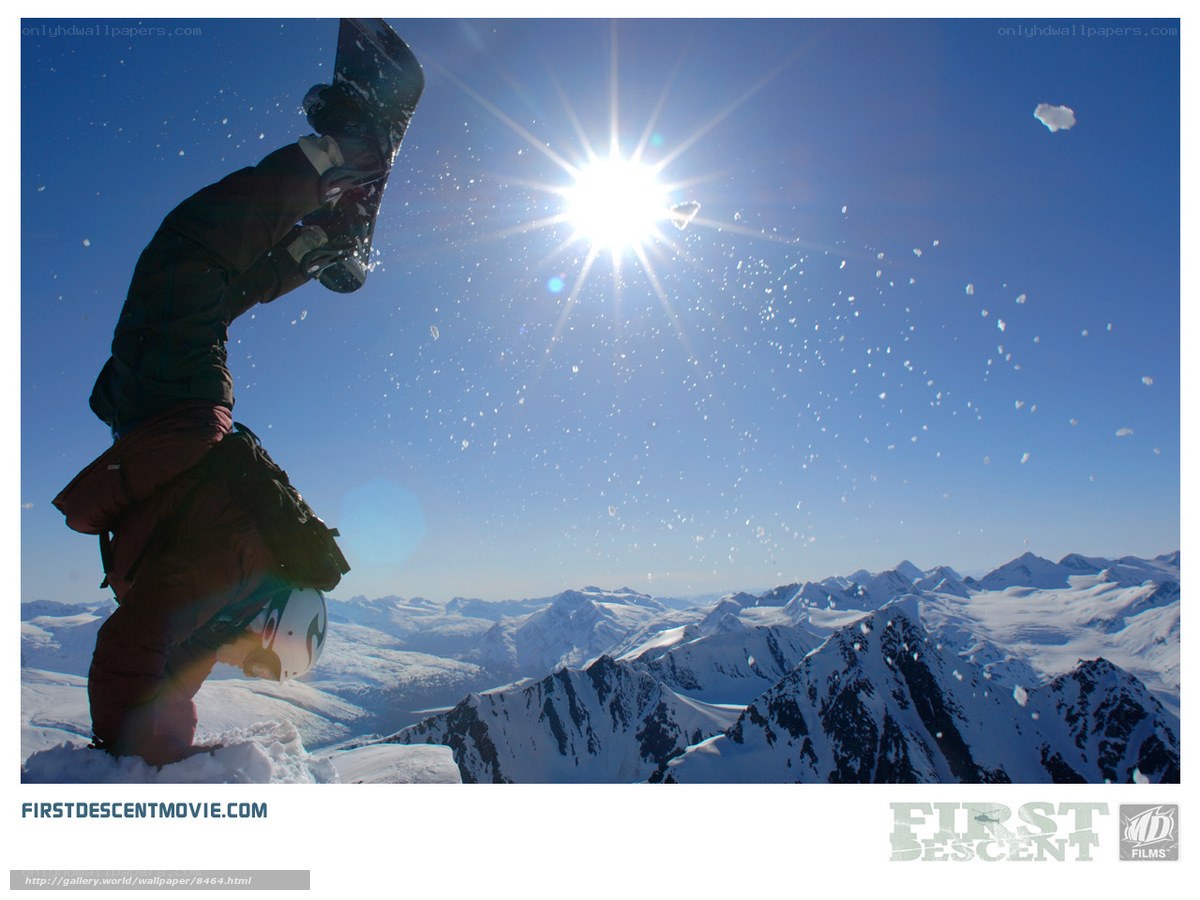 Snowboarder handstand on mountain