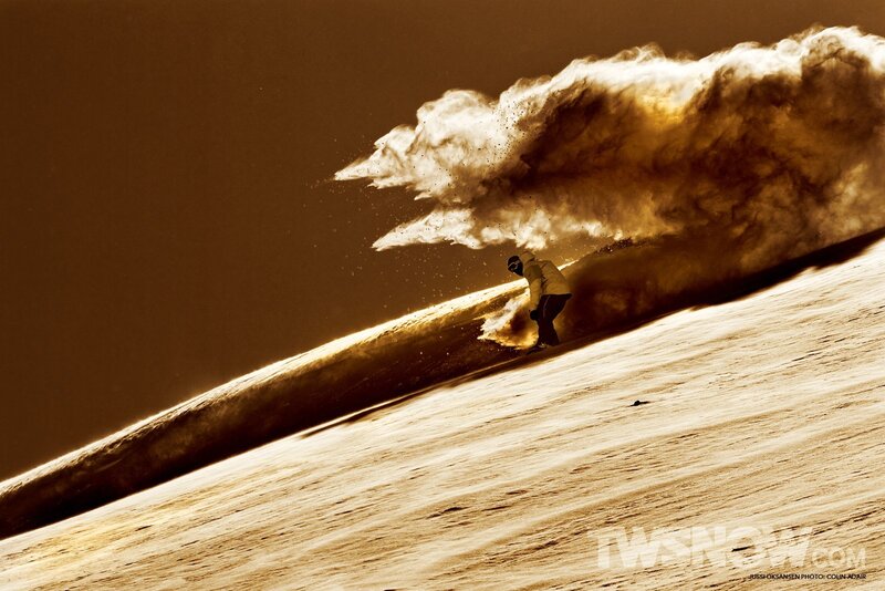 Snowboarder in a powder cloud