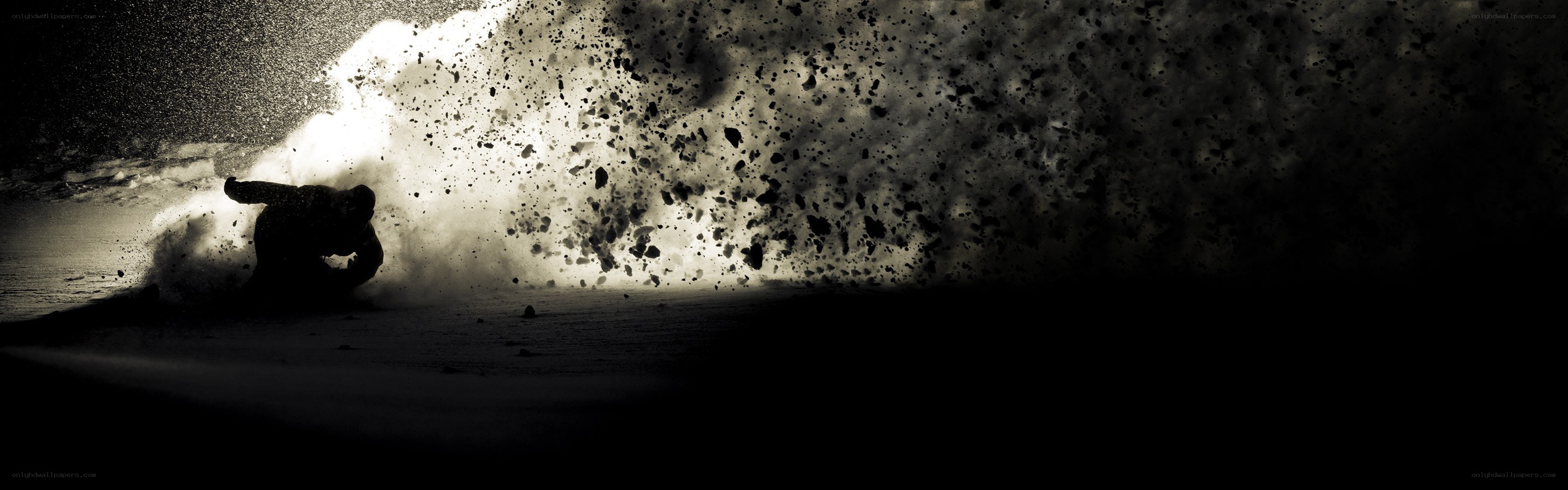 Snowboarder in a snow explosion