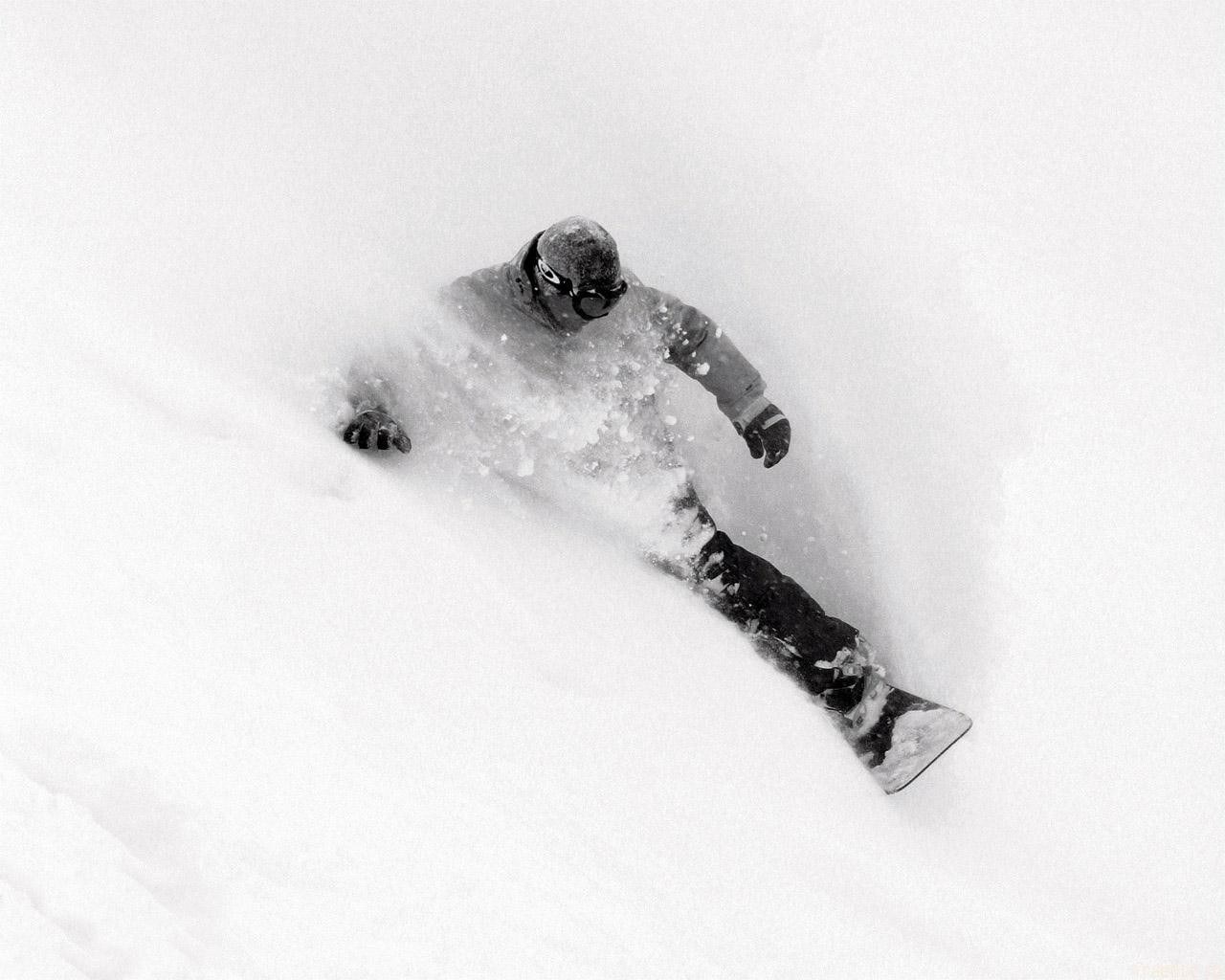 Snowboarder in deep powder