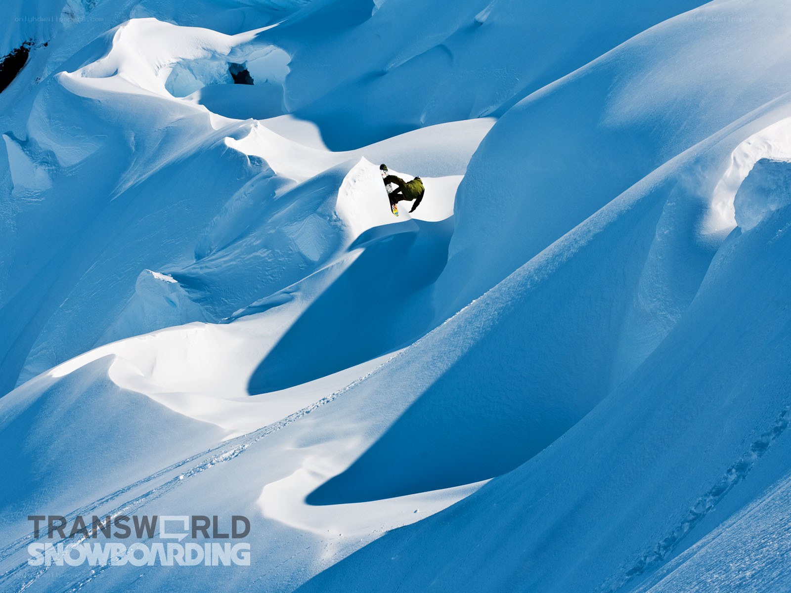 Snowboarder in deep powder