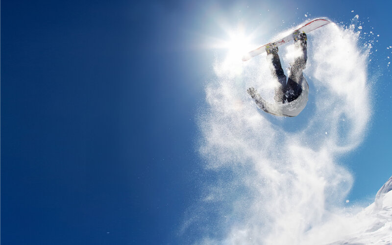 Snowboarder in Mid-air — Blue, Dynamic, Afternoon