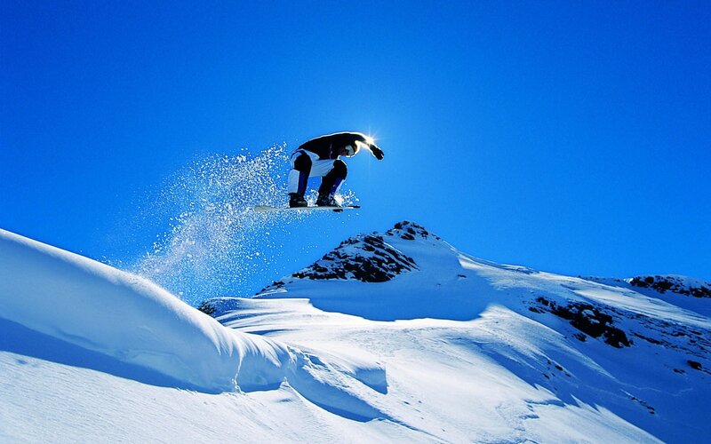 Snowboarder in Mid-air — Dramatic