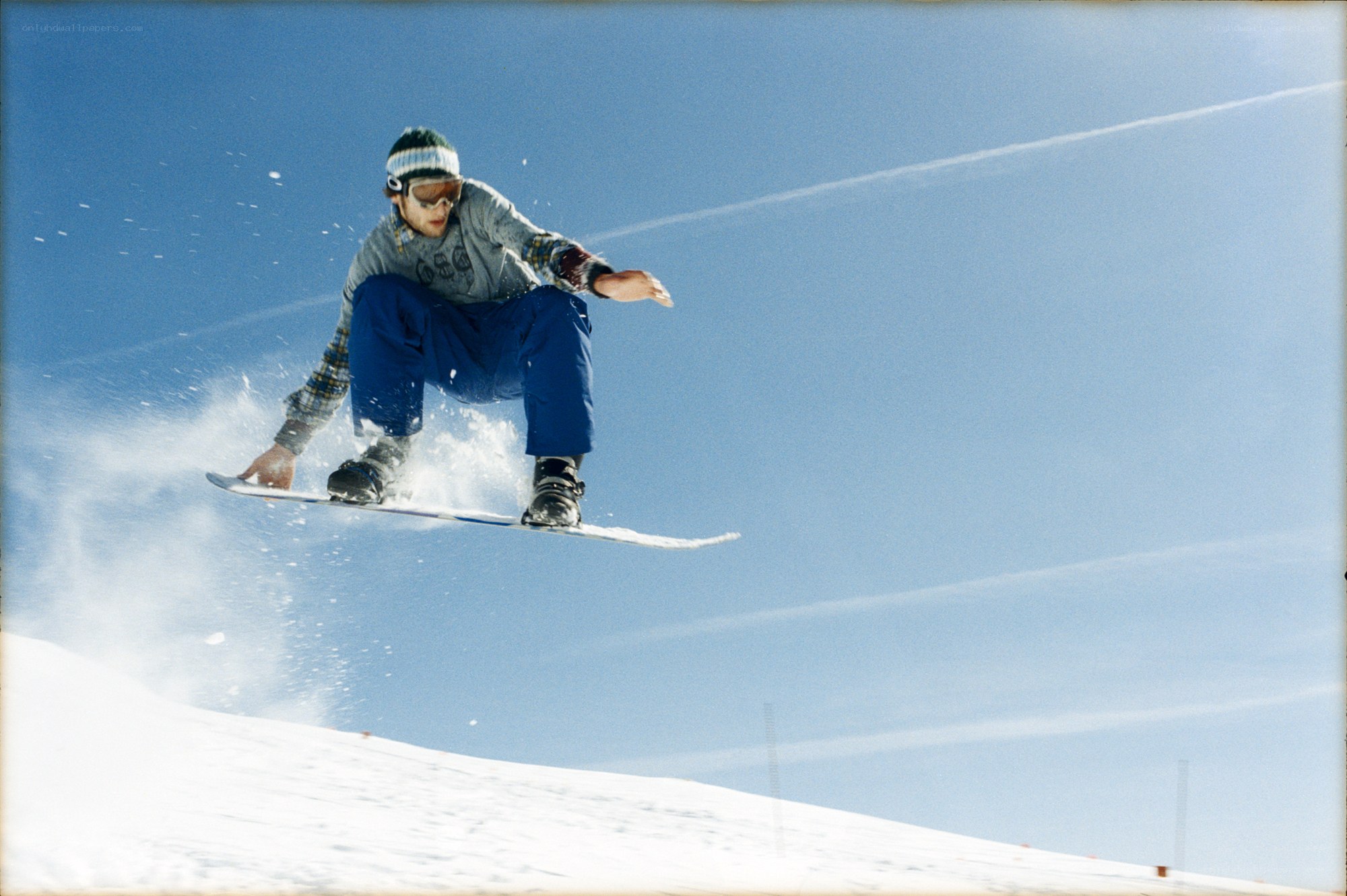 Snowboarder in mid-air jump