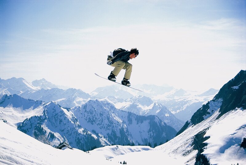 Snowboarder in mid-air jump
