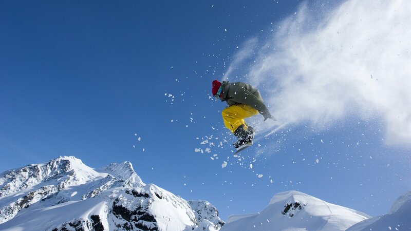 Snowboarder in mid-air jump