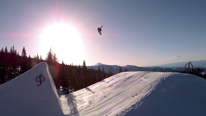 Snowboarder in mid-air jump