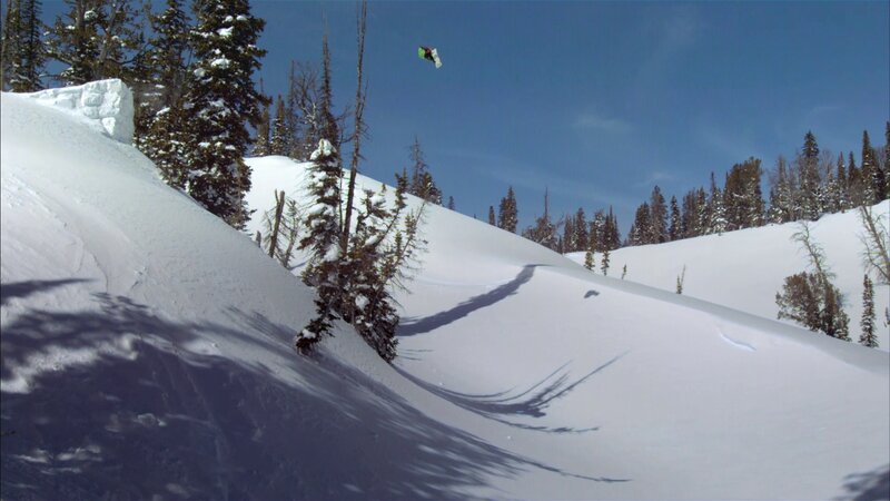 Snowboarder in mid-air jump