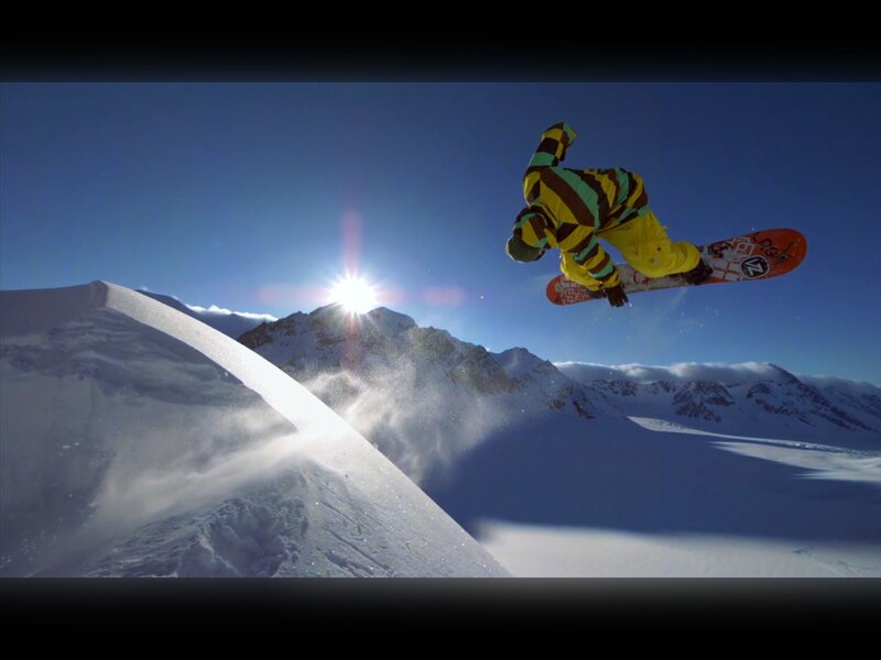 Snowboarder in mid-air jump