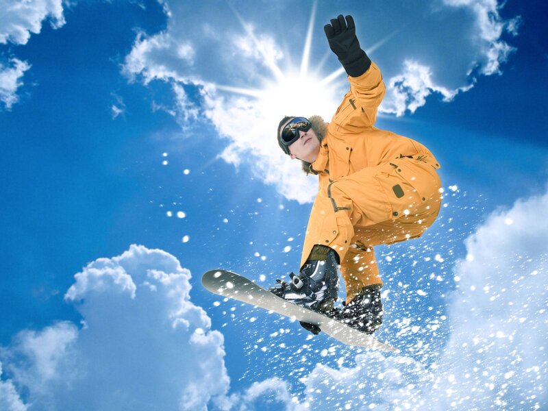 Snowboarder in mid-air jump